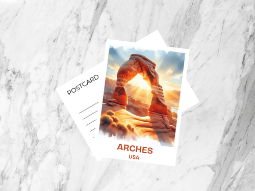 Postcard with Arches National Park image on a marble surface